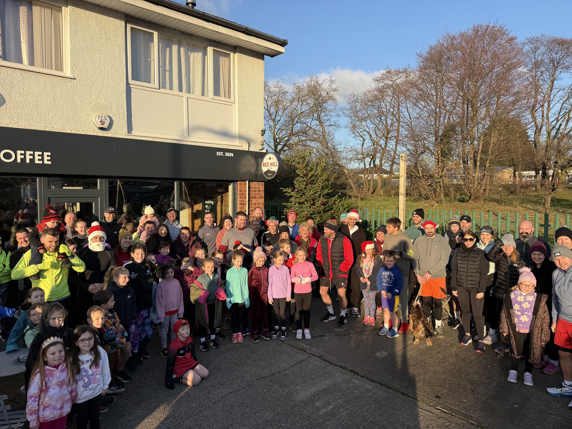 Runners, families and children gathered outside Red Hill Coffee for the Boxing Day run
